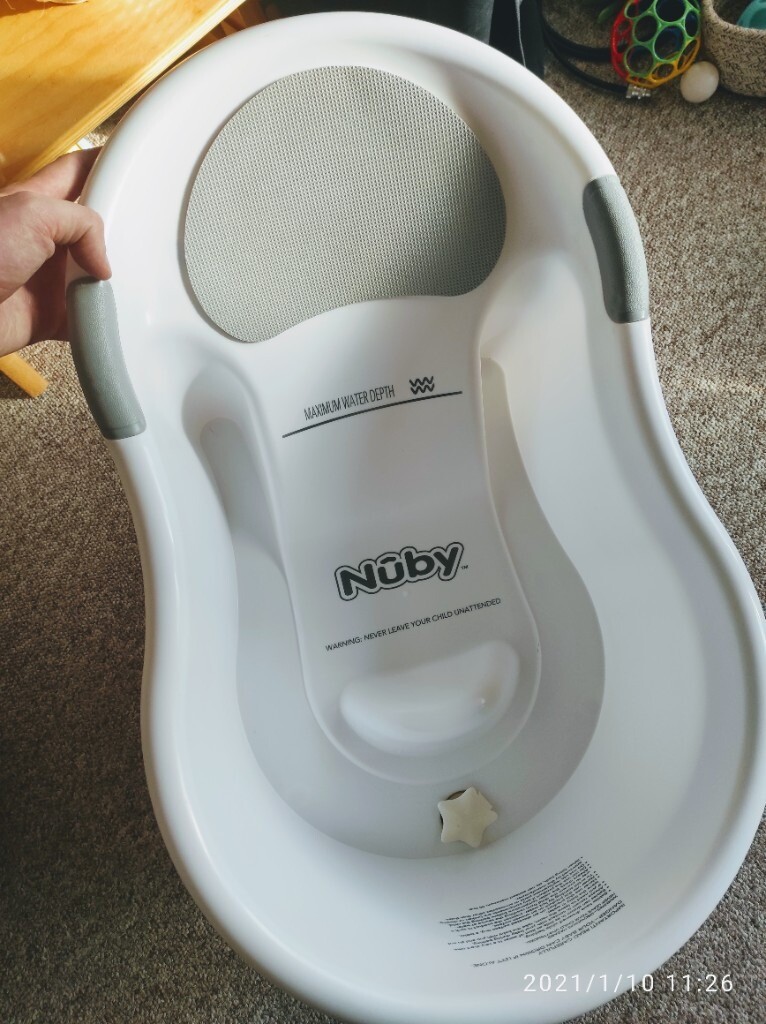 nuby baby bath with built in seat and soft headrest